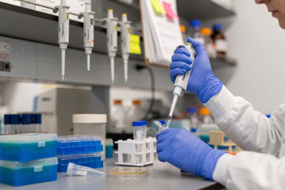 Close up of scientist working at a lab bench